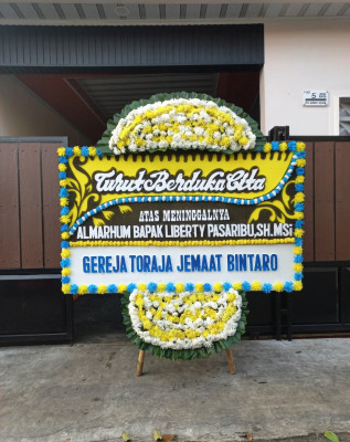 Papan Bunga Duka di Sindulang Satu